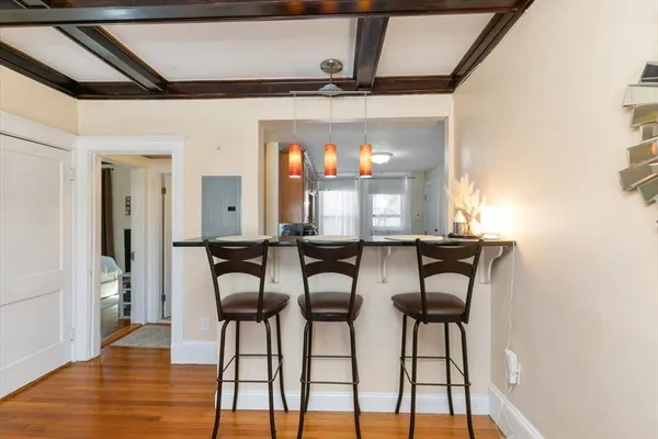 a view of a dining room with furniture and window