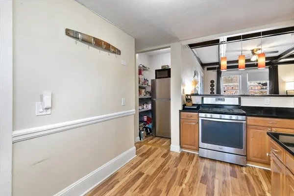 a kitchen with stainless steel appliances a stove and a refrigerator