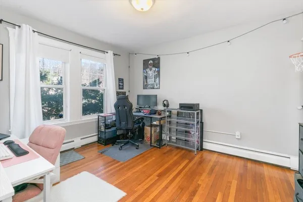 a room with furniture and a wooden floor