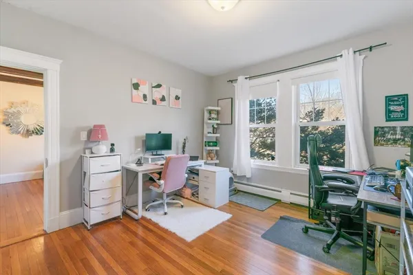 a workspace with furniture hardwood and a window