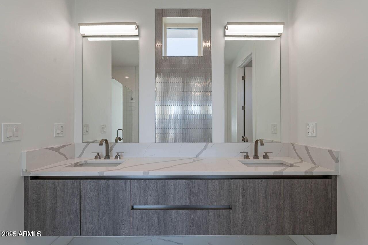 2130 East Turney Avenue, Unit 4 Phoenix, AZ 85016 - Photo 5 of 15 a bathroom with a sink double vanity and a mirror