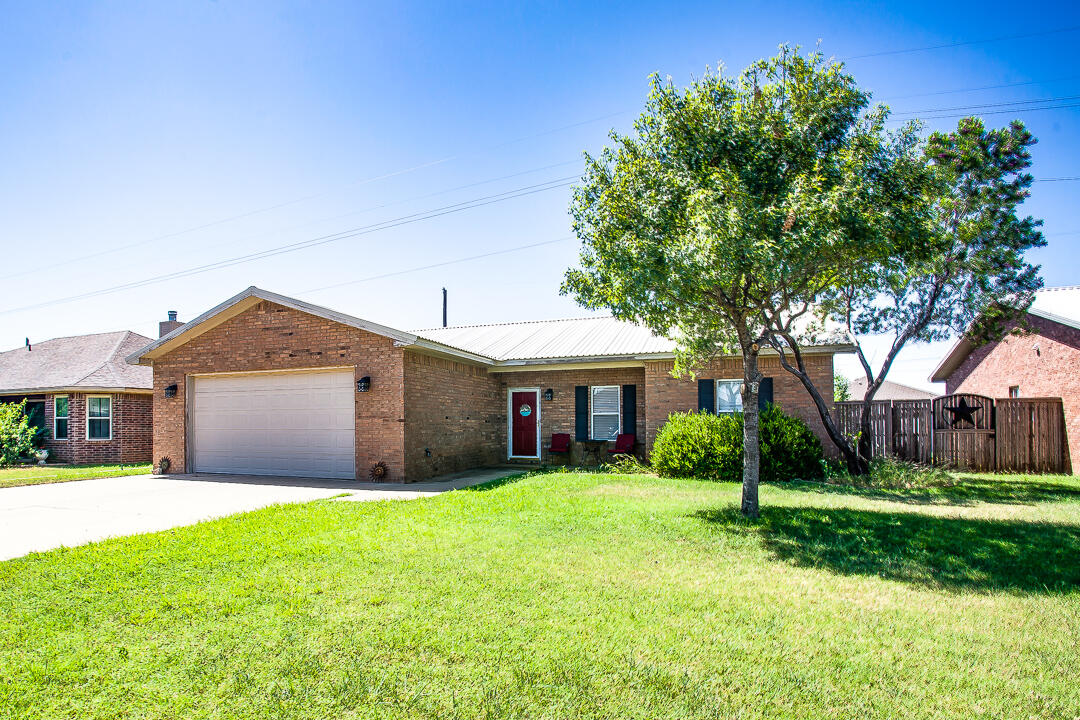 905 11th Street Wolfforth, TX 79382 - Photo 2 of 18 a front view of house with yard and green space