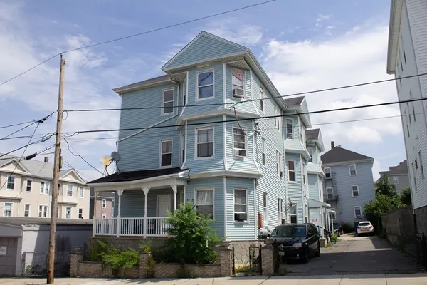 a view of a big house with a street