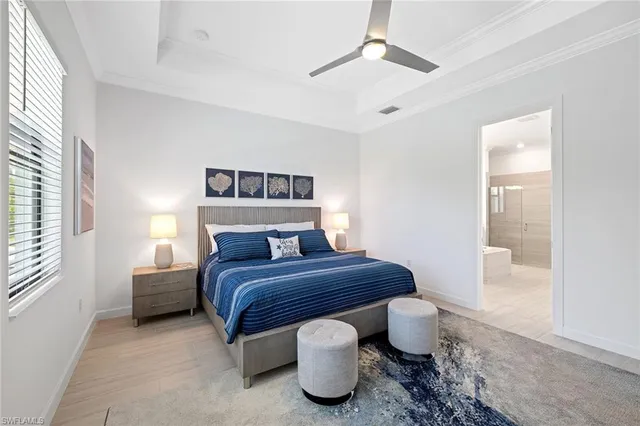 a bedroom with a bed and glass door