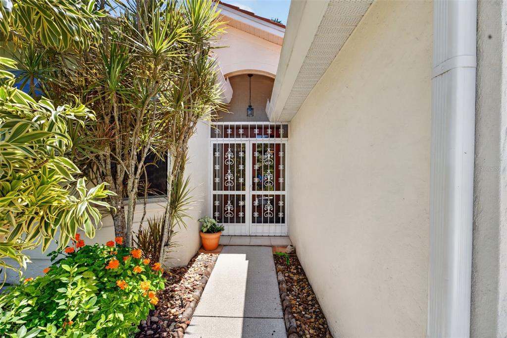 4266 Summertree Road Venice, FL 34293 - Photo 33 of 64 a front view of a house with a yard