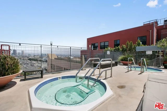 a view of a terrace with lawn chairs