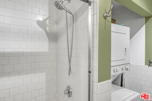 a bathroom with a bathtub and shower