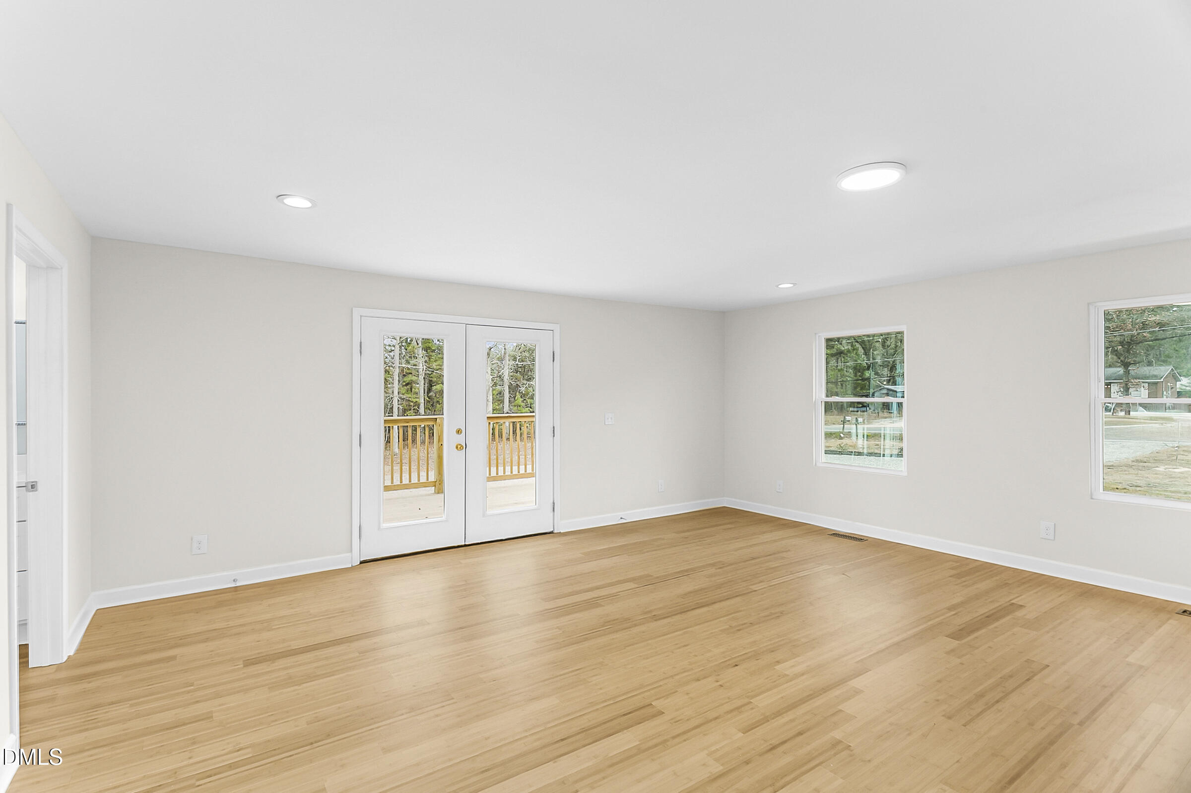 4713 South Nc 87 Graham, NC 27253 - Photo 15 of 35 an empty room with wooden floor and windows