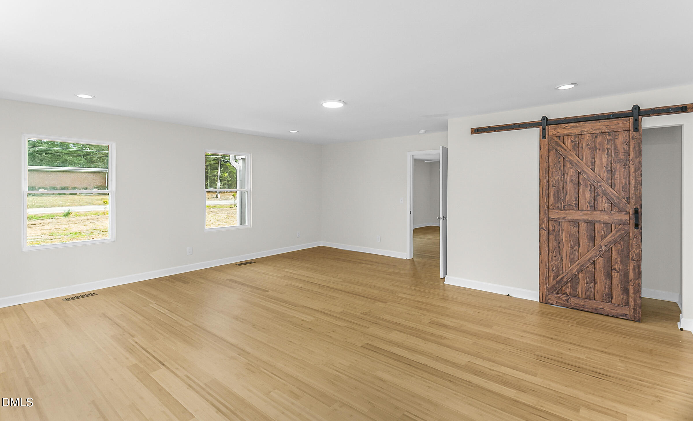 4713 South Nc 87 Graham, NC 27253 - Photo 17 of 35 a view of an empty room with wooden floor and a window
