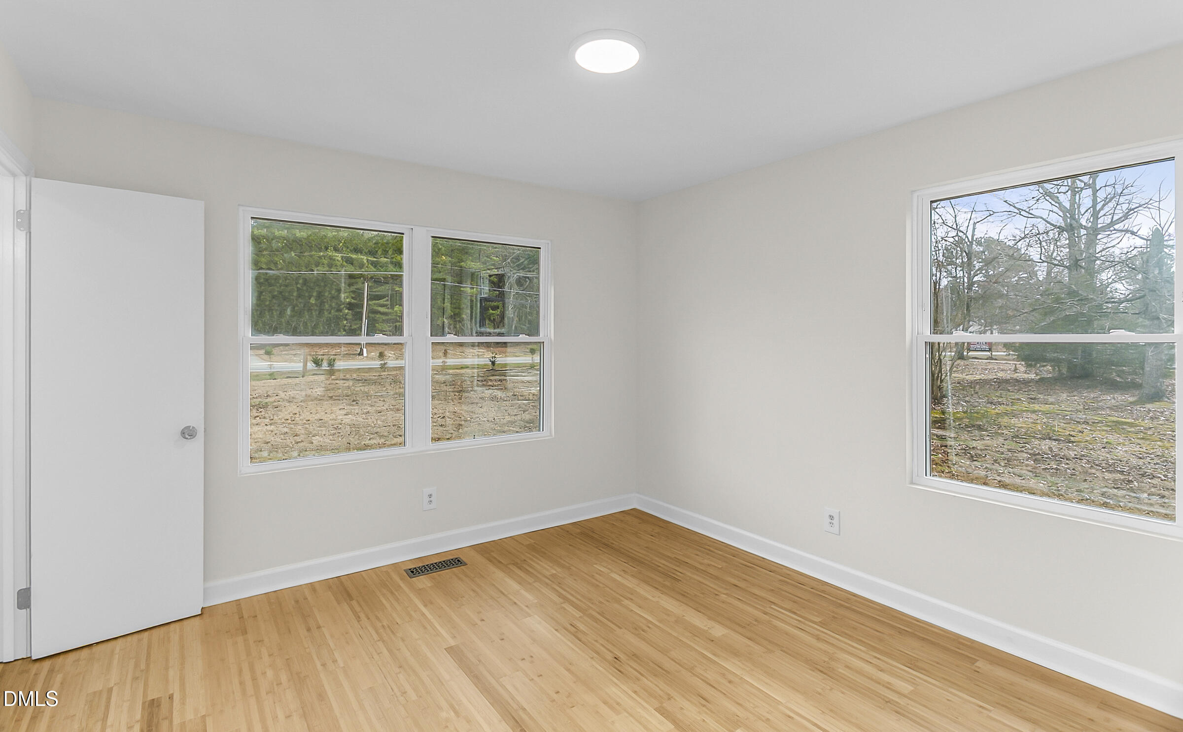 4713 South Nc 87 Graham, NC 27253 - Photo 21 of 35 a view of an empty room with wooden floor and a window