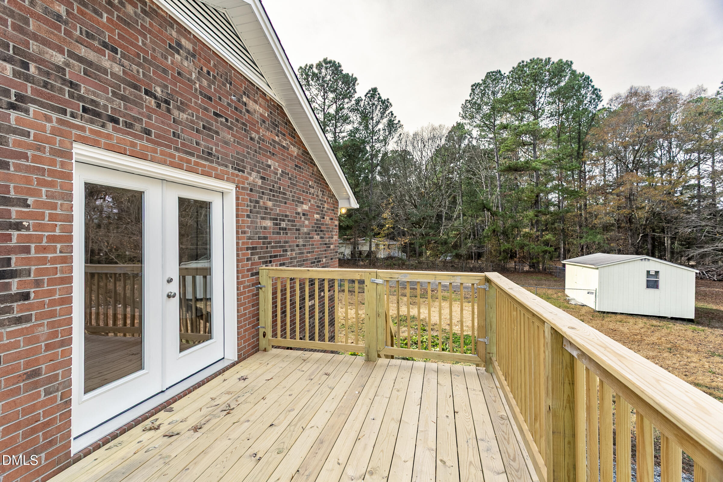 4713 South Nc 87 Graham, NC 27253 - Photo 27 of 35 a view of a balcony with wooden floor and fence