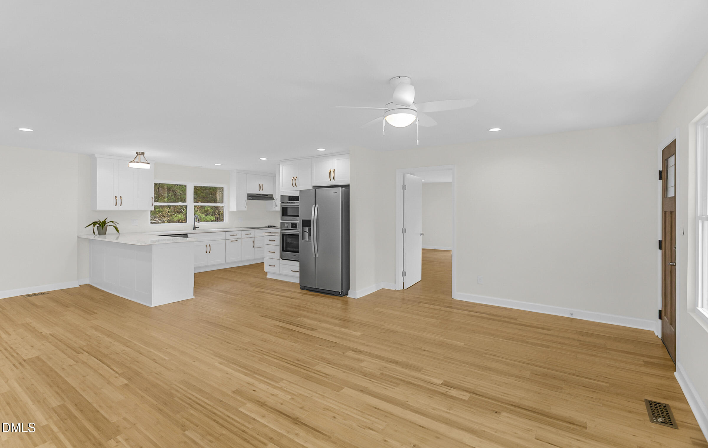 4713 South Nc 87 Graham, NC 27253 - Photo 6 of 35 a kitchen with stainless steel appliances kitchen island granite countertop a refrigerator and a sink