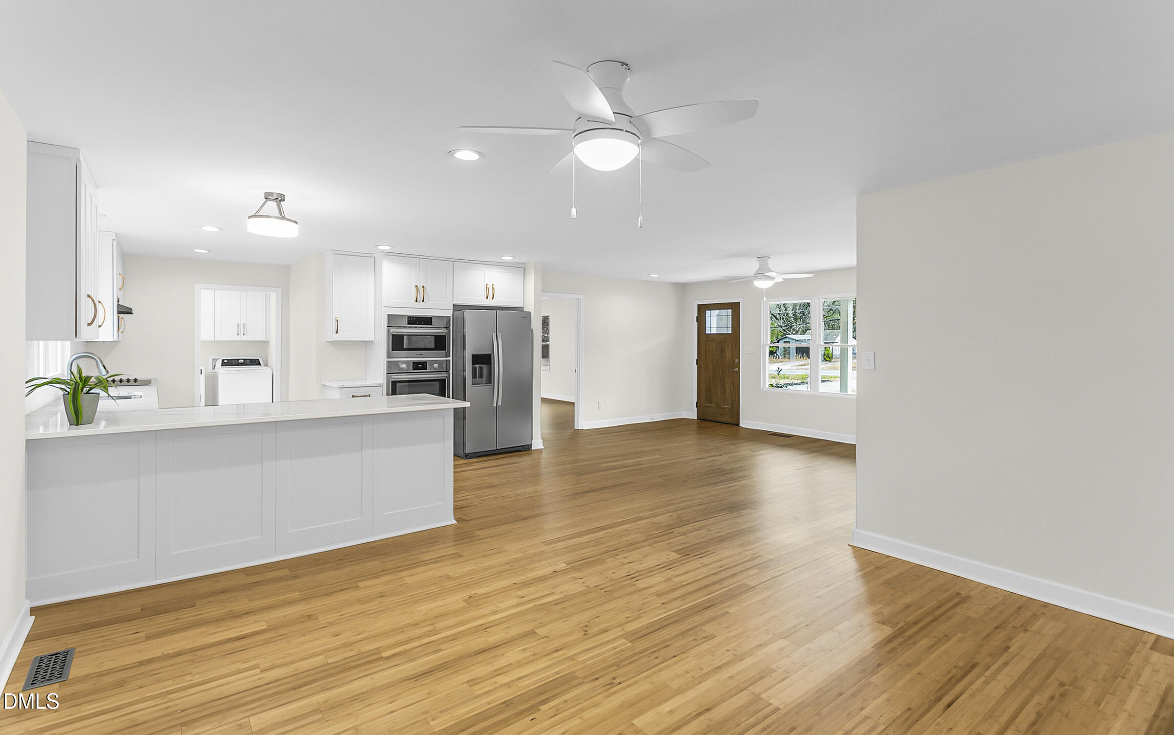 4713 South Nc 87 Graham, NC 27253 - Photo 8 of 35 a view of kitchen with kitchen island wooden floor appliances and cabinets