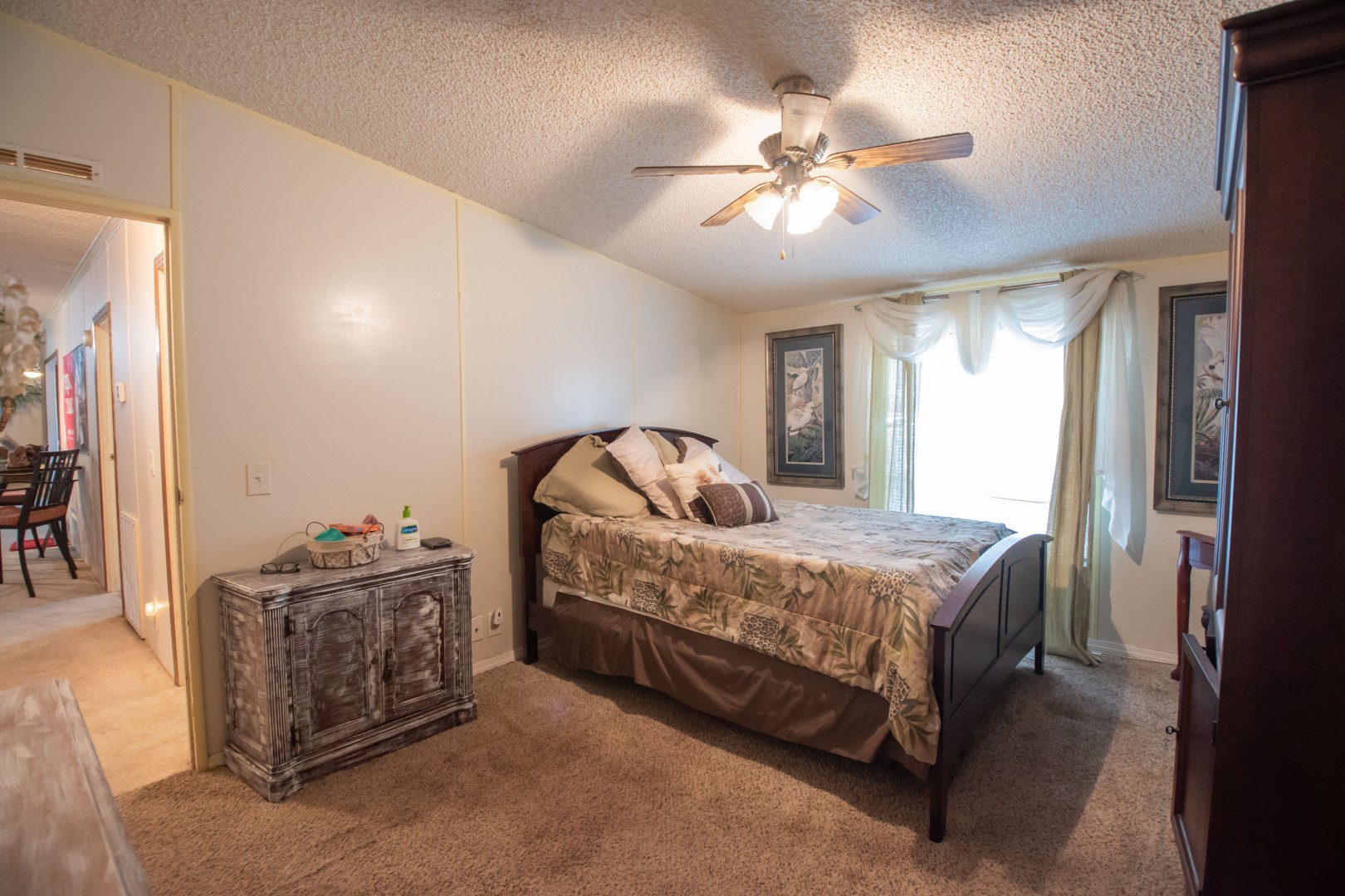 85216 Lina Road Fernandina Beach, FL 32034 - Photo 11 of 47 a bedroom with a bed and ceiling fan
