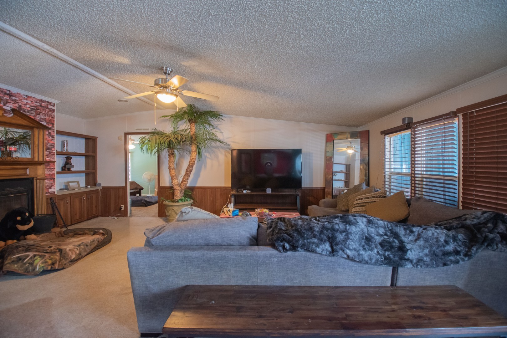 85216 Lina Road Fernandina Beach, FL 32034 - Photo 16 of 47 a living room with furniture a flat screen tv and a fireplace