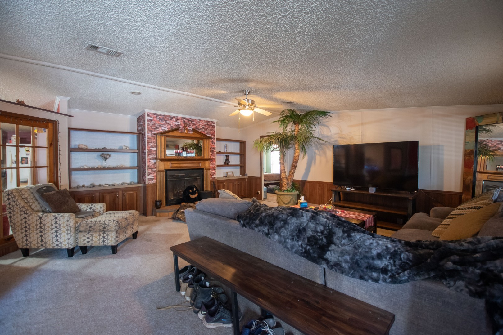 85216 Lina Road Fernandina Beach, FL 32034 - Photo 17 of 47 a living room with fireplace furniture and a flat screen tv