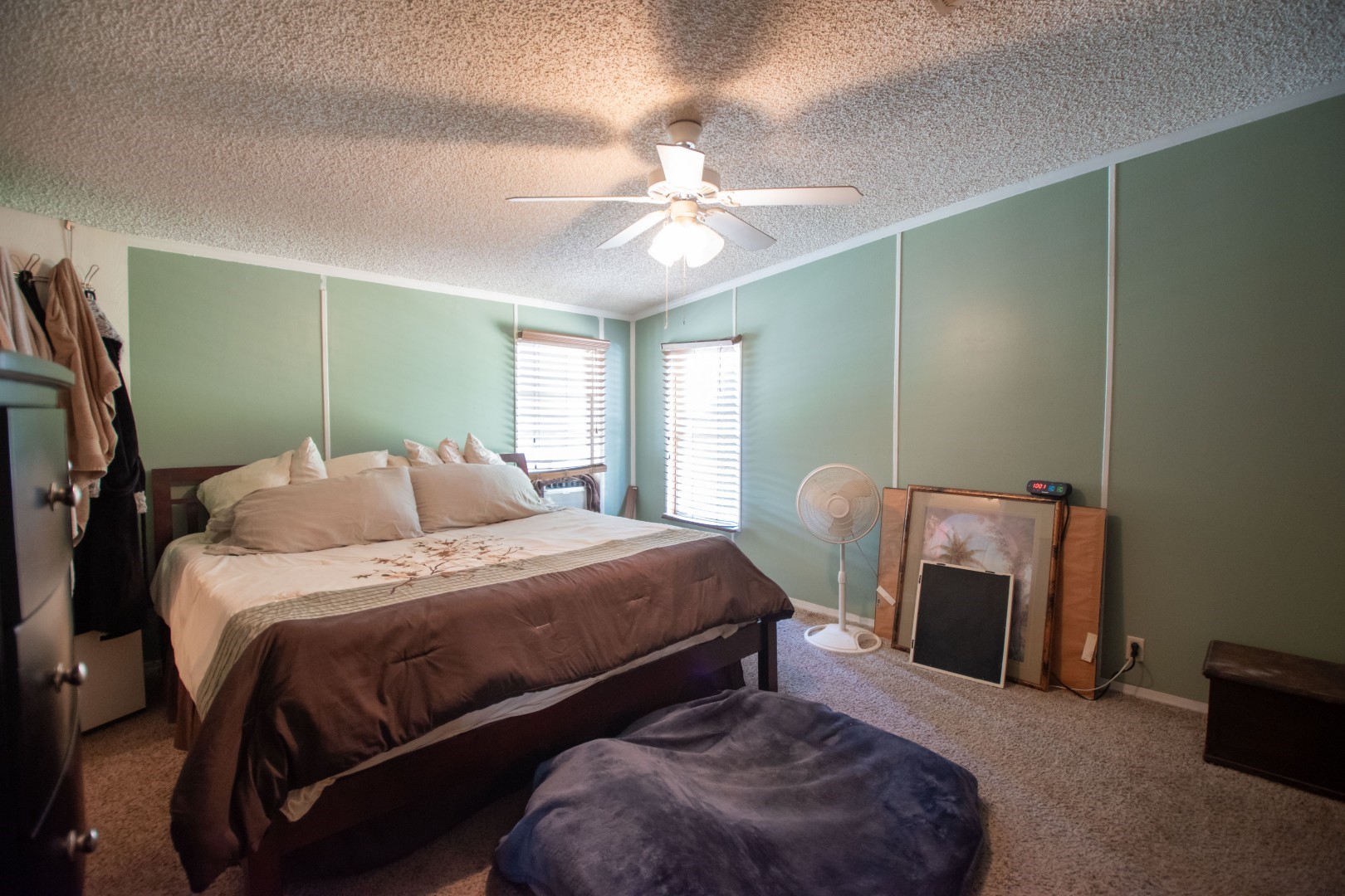 85216 Lina Road Fernandina Beach, FL 32034 - Photo 18 of 47 a bedroom with a bed and a chandelier