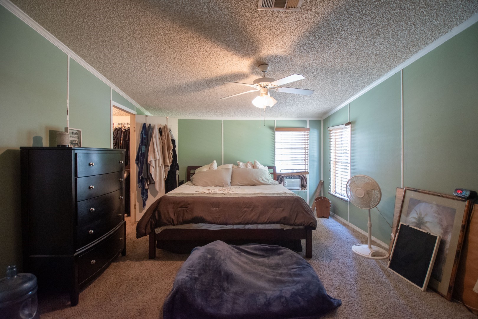 85216 Lina Road Fernandina Beach, FL 32034 - Photo 19 of 47 a bed room with a bed and a chandelier