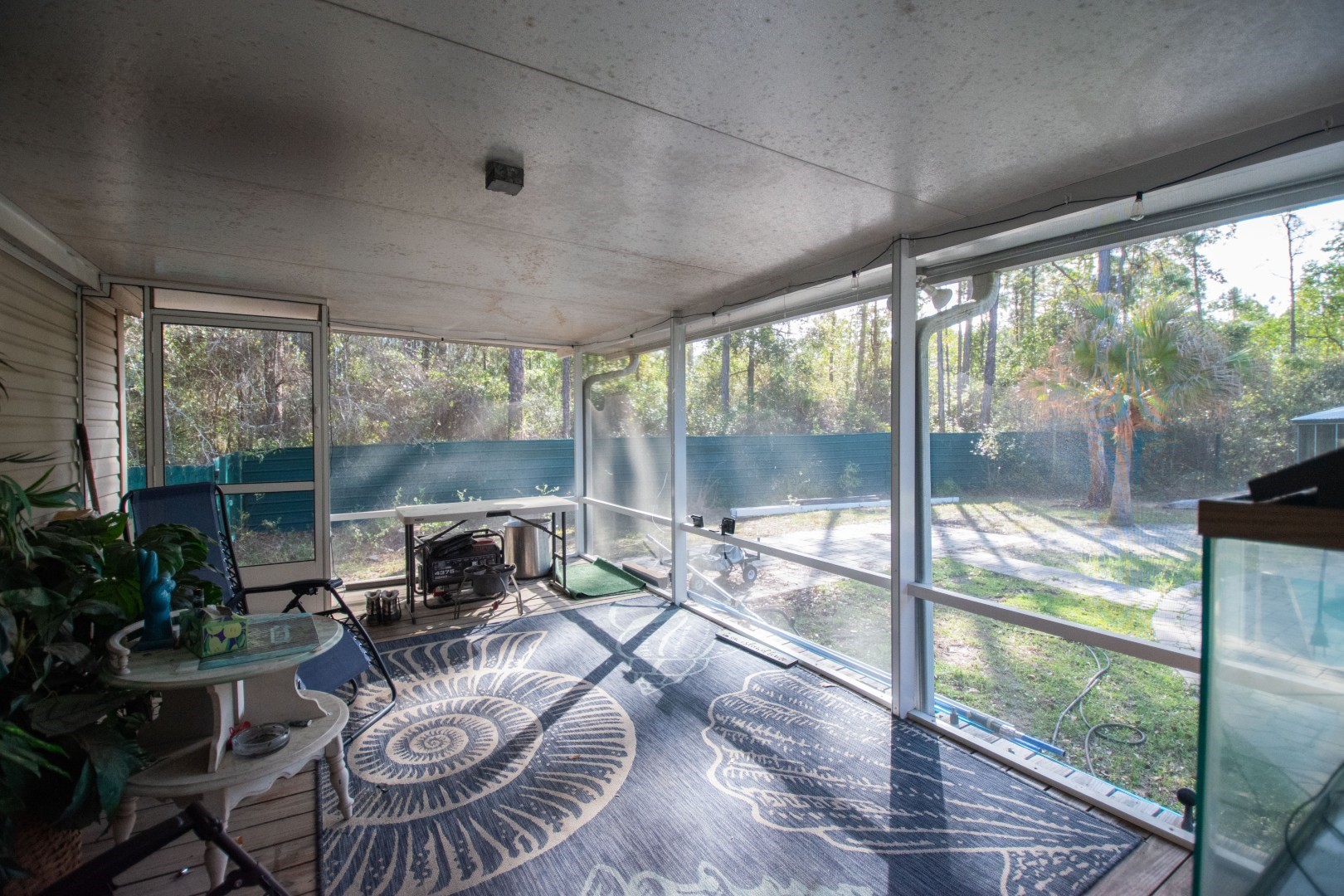 85216 Lina Road Fernandina Beach, FL 32034 - Photo 33 of 47 a living room with furniture and a floor to ceiling window