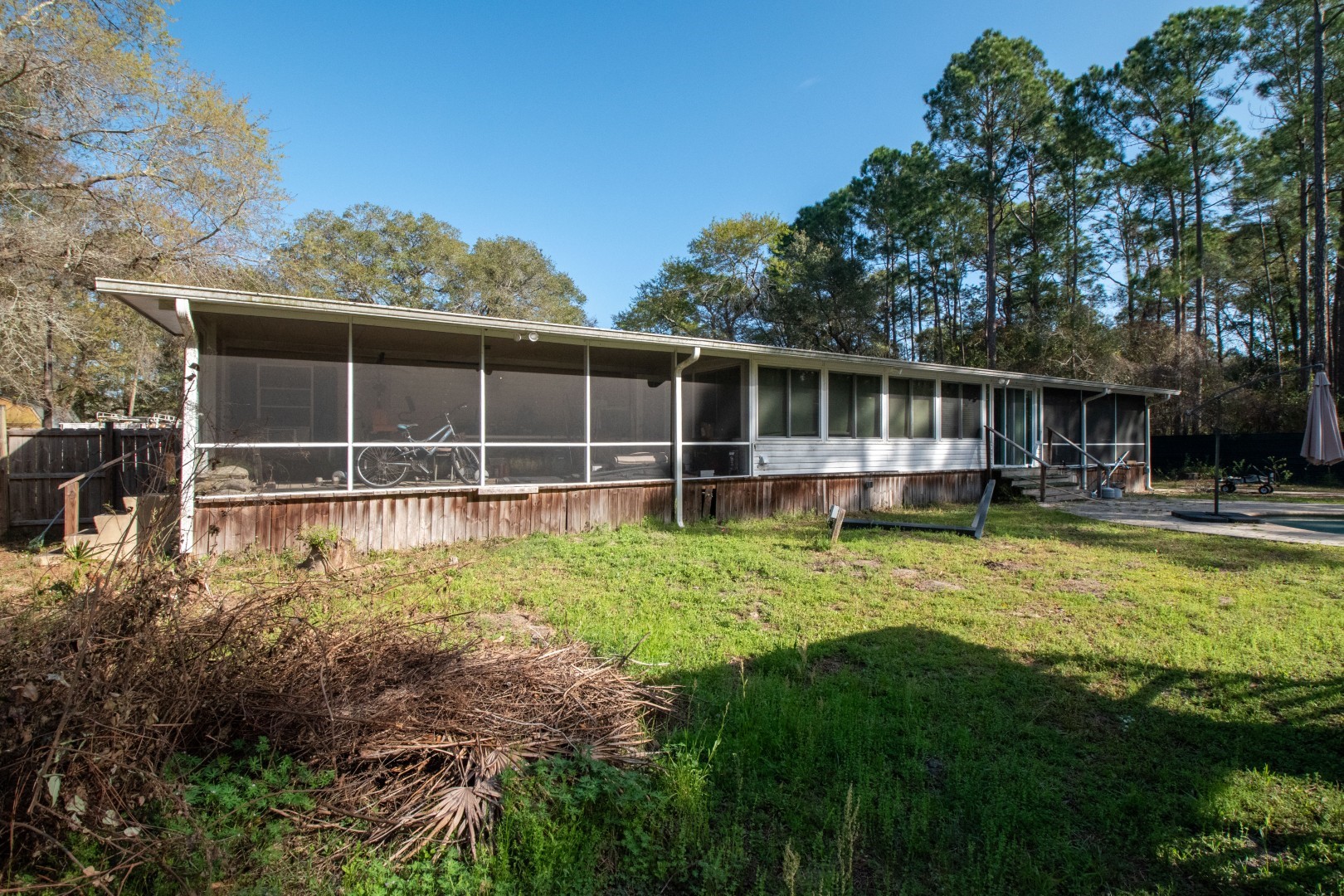 85216 Lina Road Fernandina Beach, FL 32034 - Photo 36 of 47 a view of a house with backyard sitting area and garden