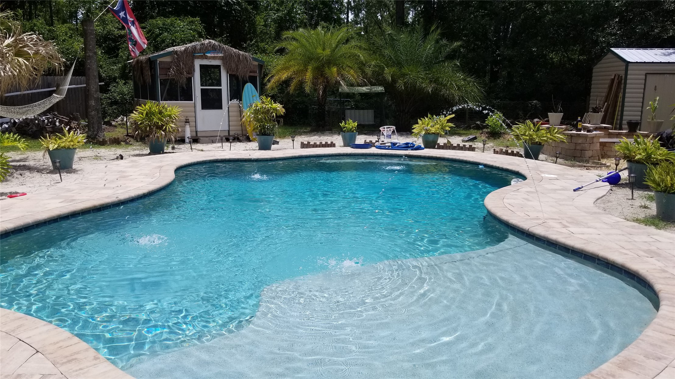 85216 Lina Road Fernandina Beach, FL 32034 - Photo 44 of 47 a view of a house with swimming pool lawn chairs and a yard
