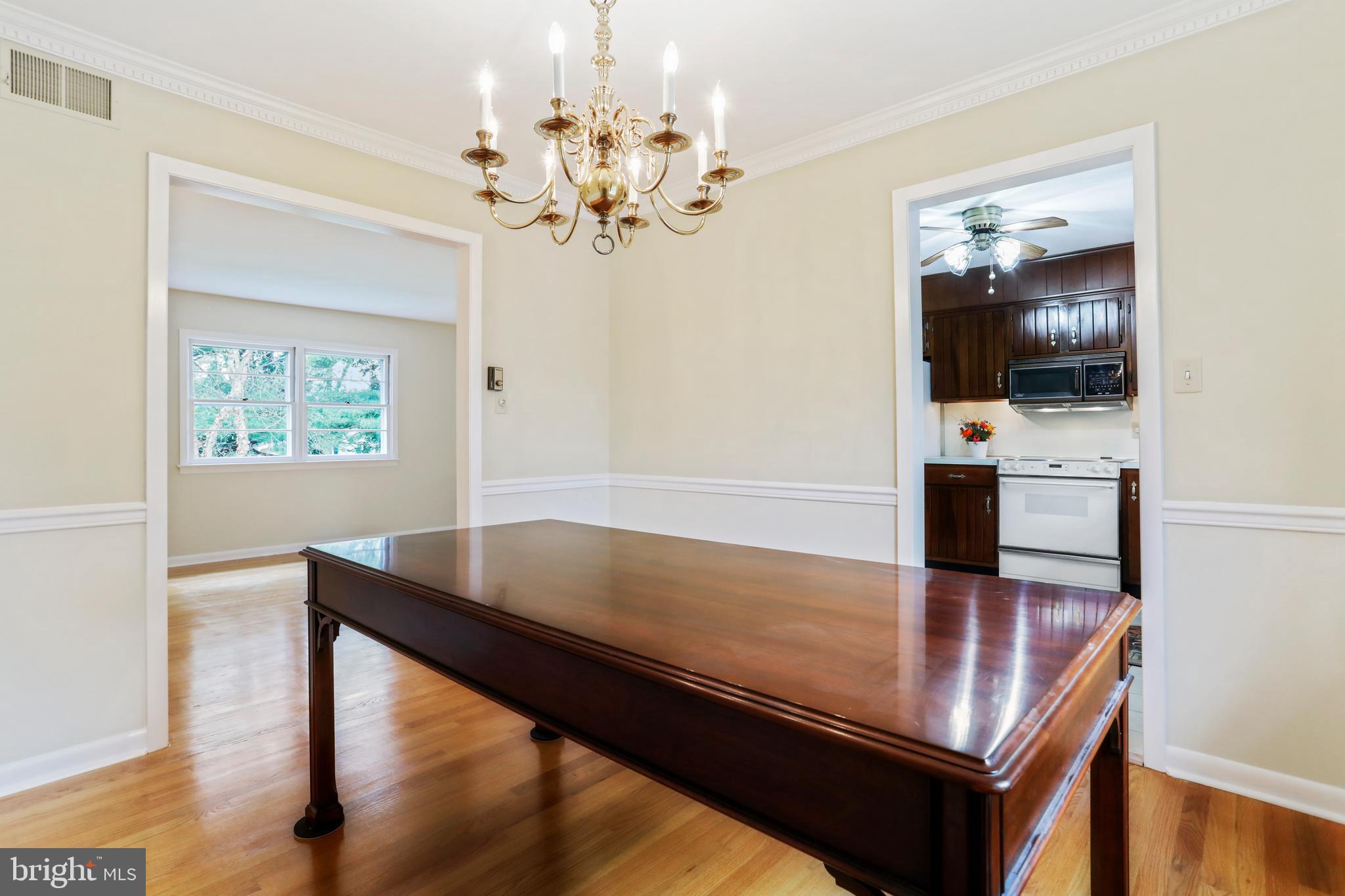 10600 Harry Heth Road Williamsport, MD 21795 - Photo 12 of 52 Formal Dining Room 10' X 11, With Brass Chandelier
