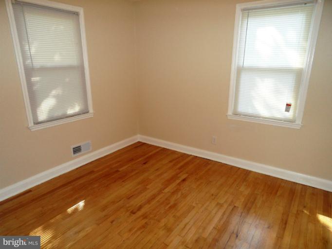 7402 Marston Road Baltimore, MD 21207 - Photo 8 of 24 an empty room with a window