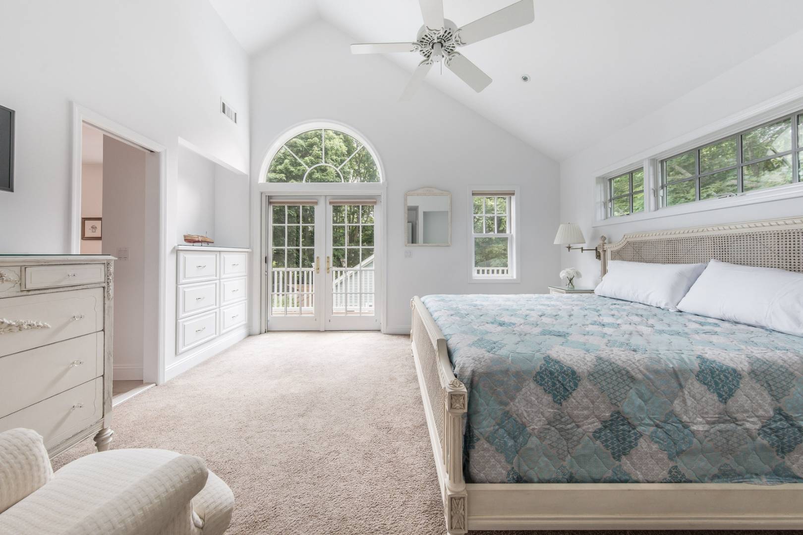 15 Hamilton Street Sag Harbor, NY 11963 - Photo 6 of 10 a bedroom with a large bed mirror and furniture