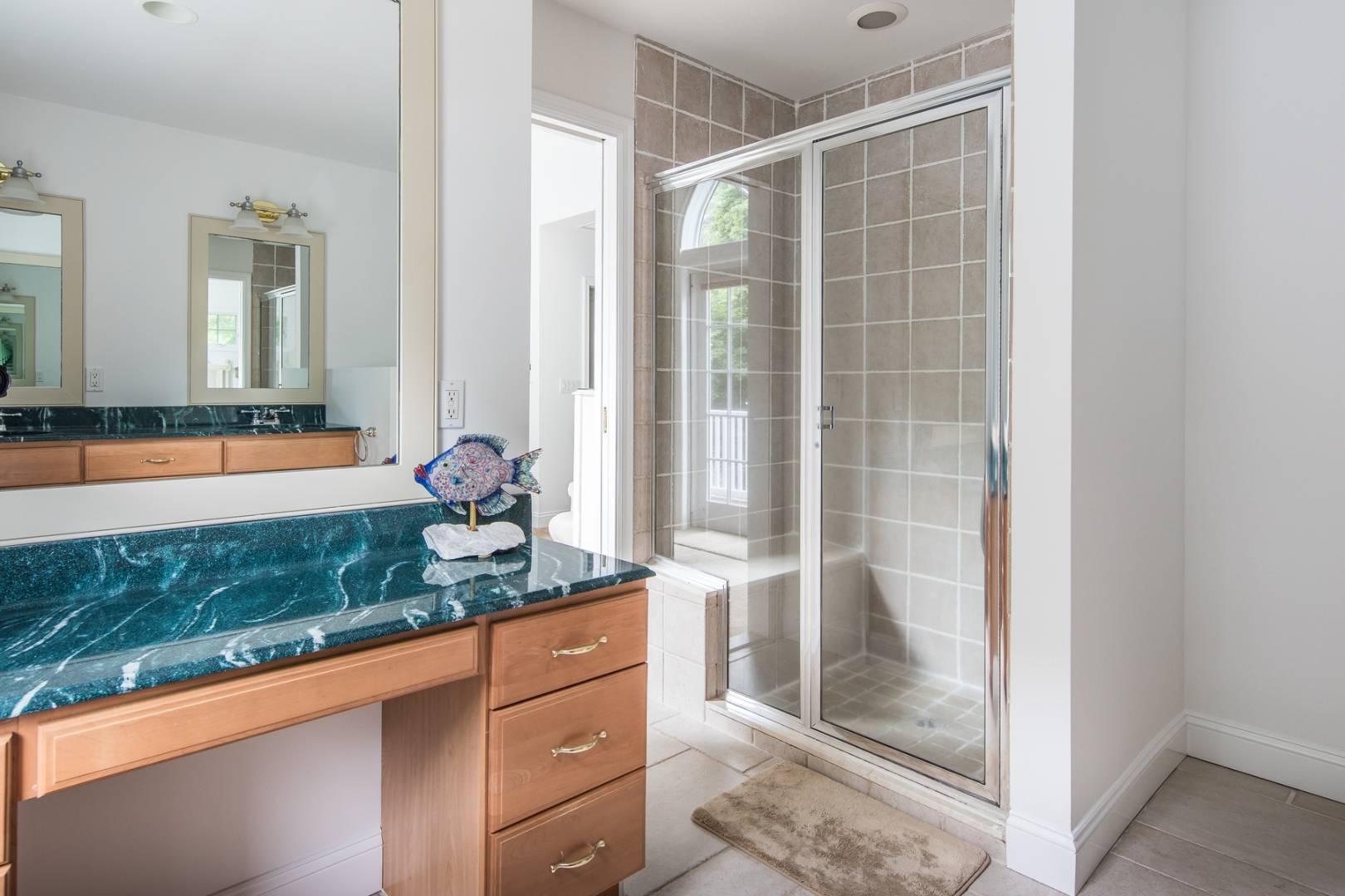 15 Hamilton Street Sag Harbor, NY 11963 - Photo 9 of 10 a bathroom with a granite countertop sink and a mirror