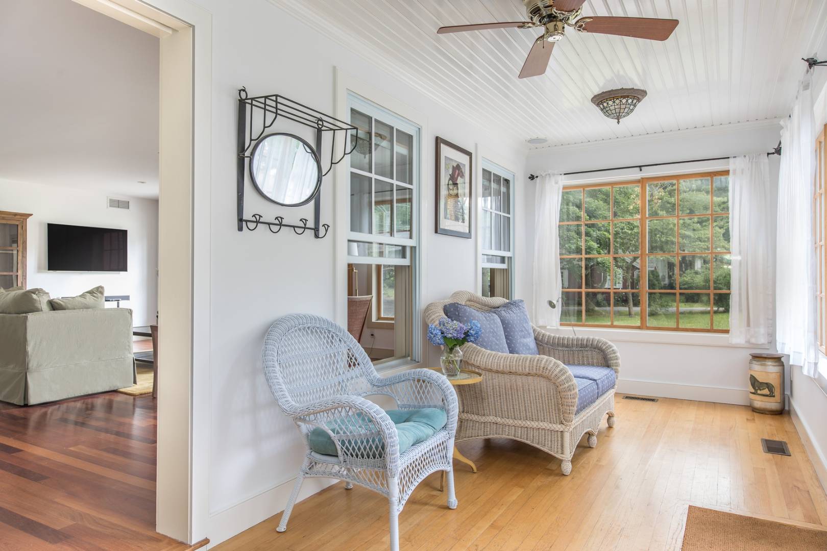 15 Hamilton Street Sag Harbor, NY 11963 - Photo 10 of 10 a living room with furniture a flat screen tv and a window