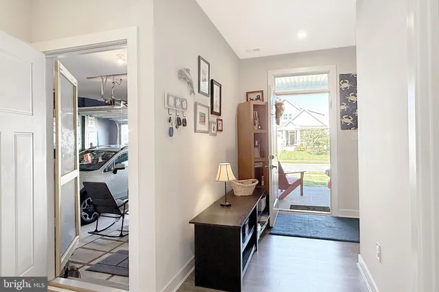 a view of a hallway with living room and furniture