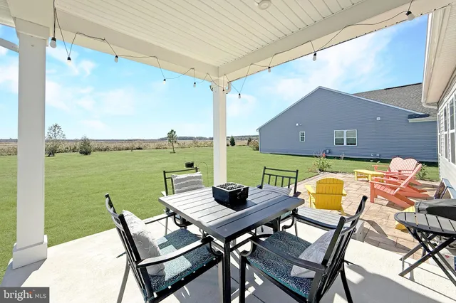 a view of a balcony with table and chairs