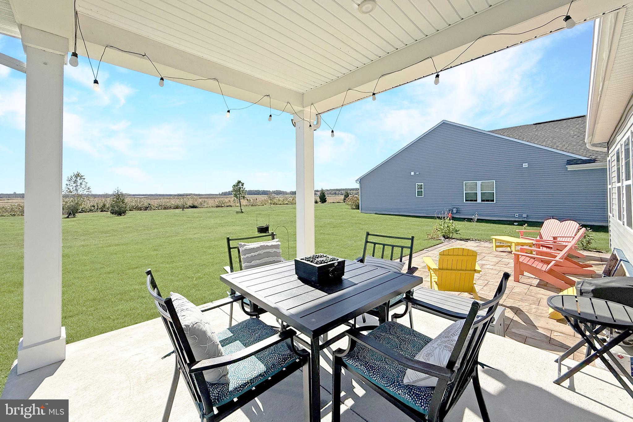 24901 Long Cove Court Millsboro, DE 19966 - Photo 17 of 23 a view of a balcony with table and chairs