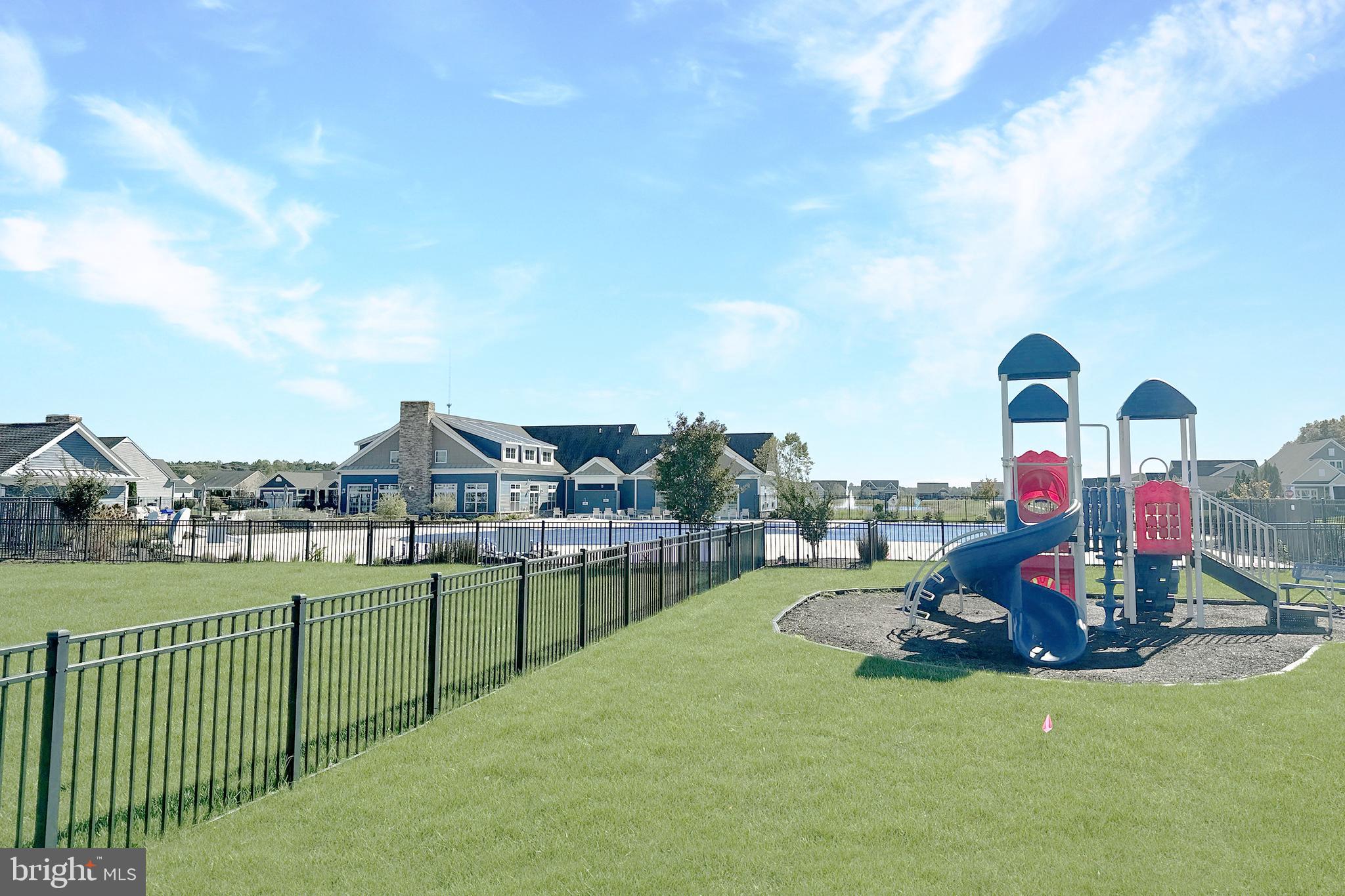 24901 Long Cove Court Millsboro, DE 19966 - Photo 22 of 23 a view of a house with a swimming pool