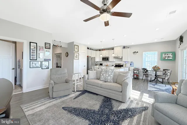a living room with furniture and a rug