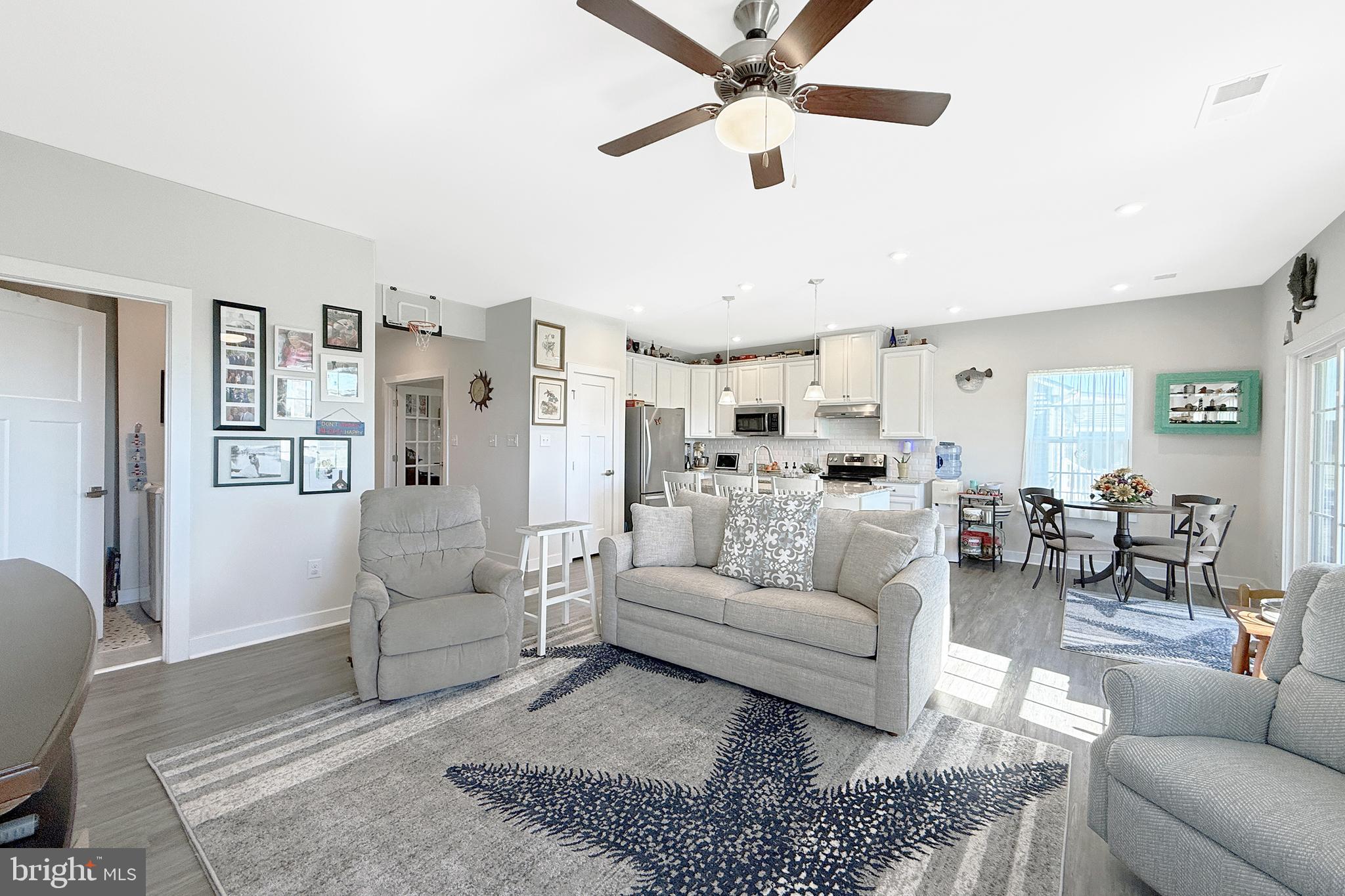 24901 Long Cove Court Millsboro, DE 19966 - Photo 3 of 23 a living room with furniture and a rug