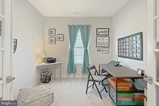 a workspace with furniture and window