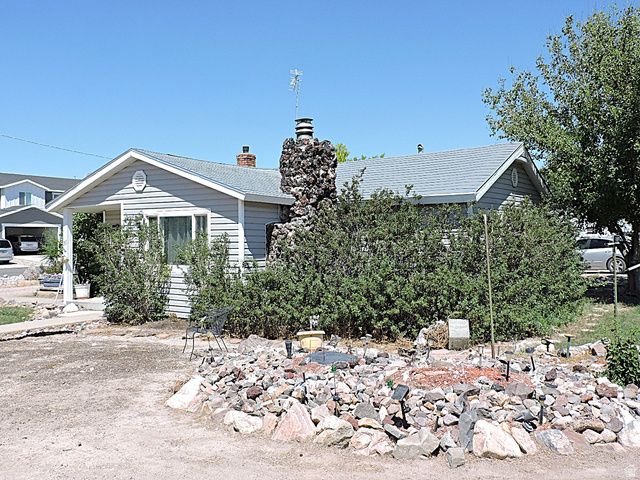 355 South Center Street Delta, UT 84624 - Photo 20 of 21 Single-story residence featuring light gray siding and a gray shingle roof