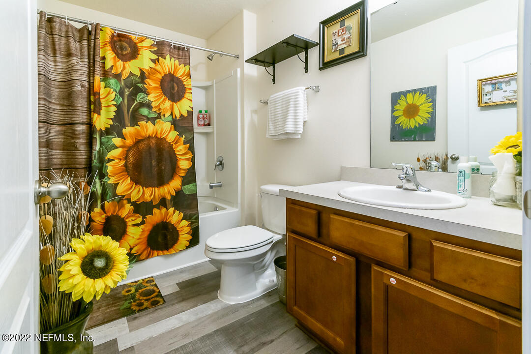 3807 Bronco Road Middleburg, FL 32068 - Photo 12 of 25 a bathroom with a sink toilet and shower