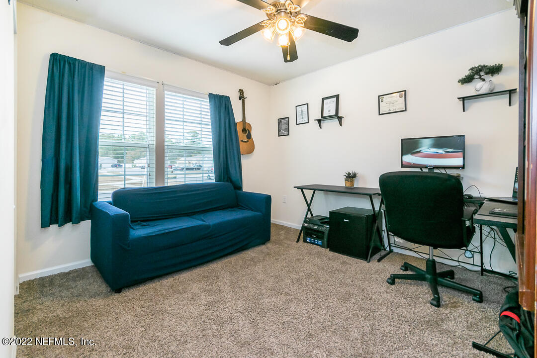 3807 Bronco Road Middleburg, FL 32068 - Photo 8 of 25 a living room with furniture and a window