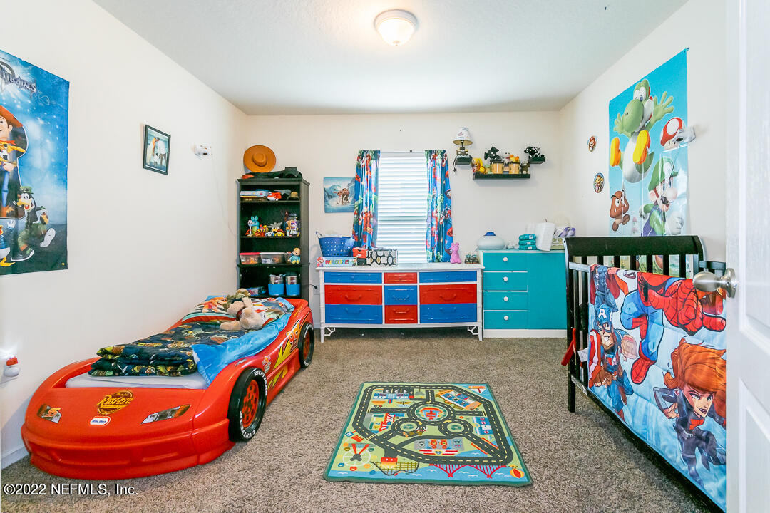 3807 Bronco Road Middleburg, FL 32068 - Photo 10 of 25 a room with toys and dresser