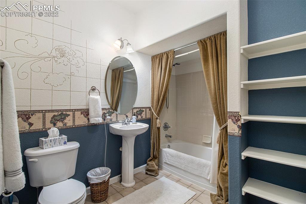 1472 Thunder Butte Road Castle Rock, CO 80109 - Photo 6 of 10 a bathroom with a toilet sink and bathtub