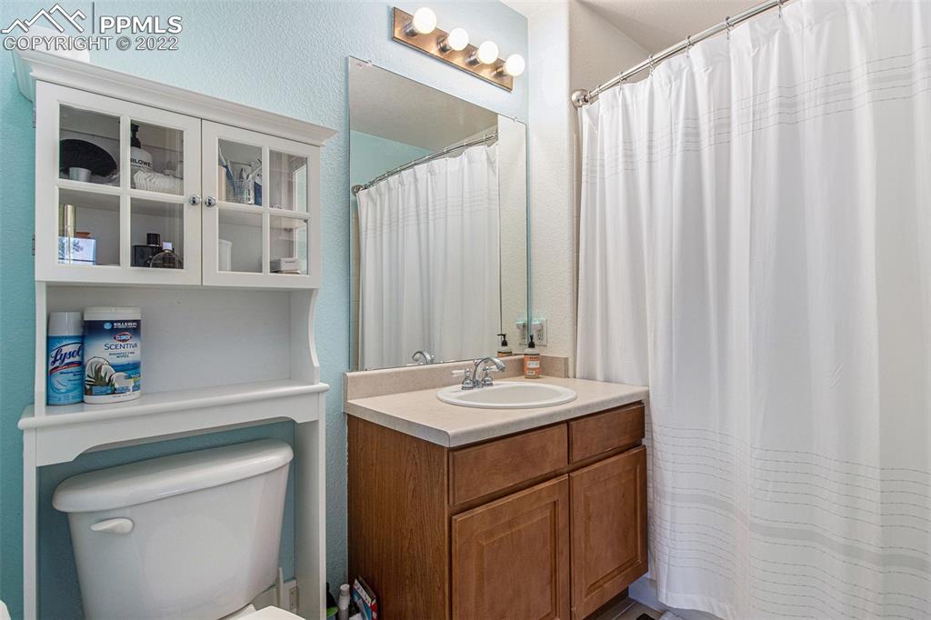 1472 Thunder Butte Road Castle Rock, CO 80109 - Photo 9 of 10 a bathroom with a sink and a mirror