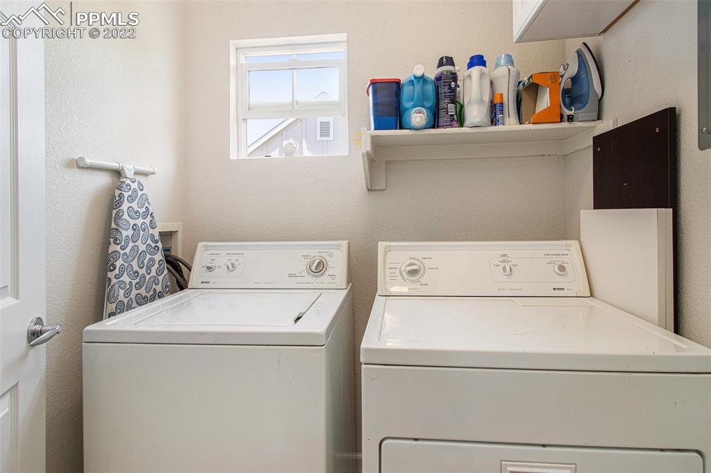 1472 Thunder Butte Road Castle Rock, CO 80109 - Photo 10 of 10 a utility room with dryer and washer