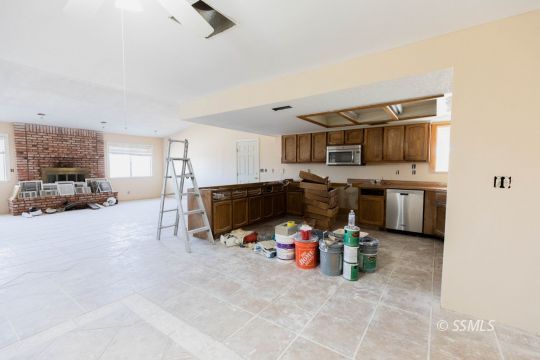 1653 South Fire Opal Street Ridgecrest, CA 93555 - Photo 9 of 28 a room with furniture and a flat screen tv