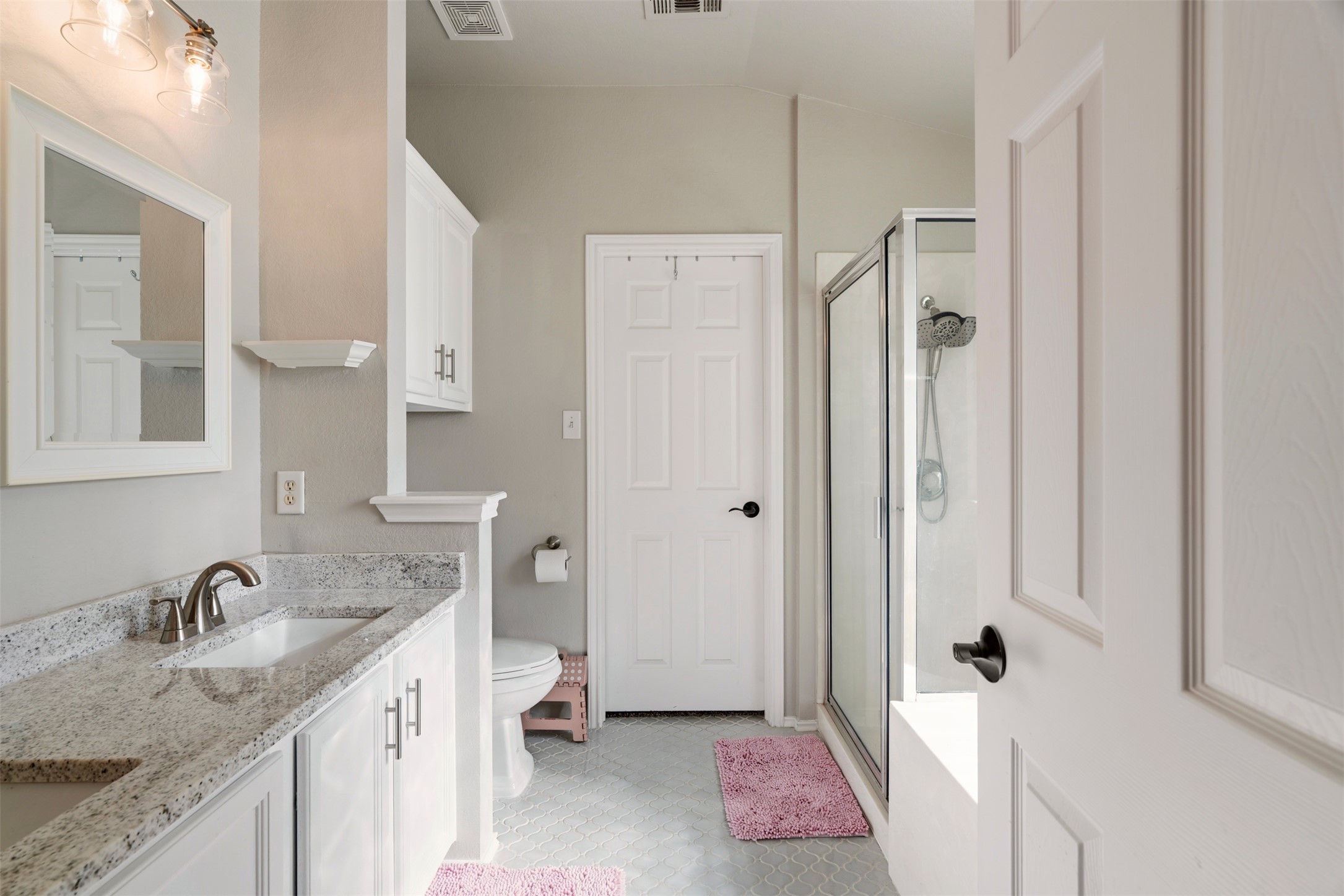 913 Bogart Road Cedar Park, TX 78613 - Photo 13 of 27 Bathroom featuring a shower stall and double vanity