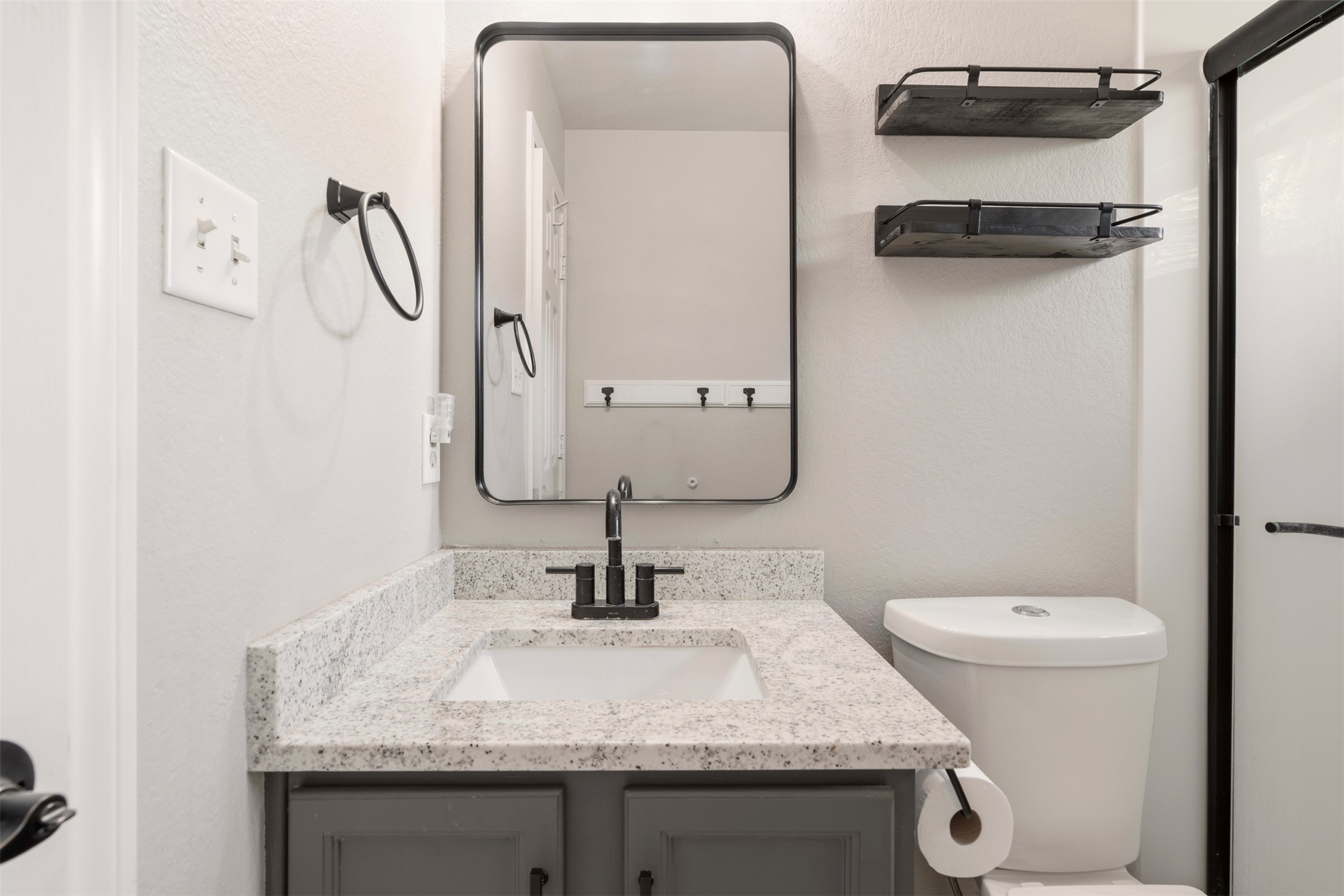 913 Bogart Road Cedar Park, TX 78613 - Photo 18 of 27 Bathroom with vanity and a textured wall