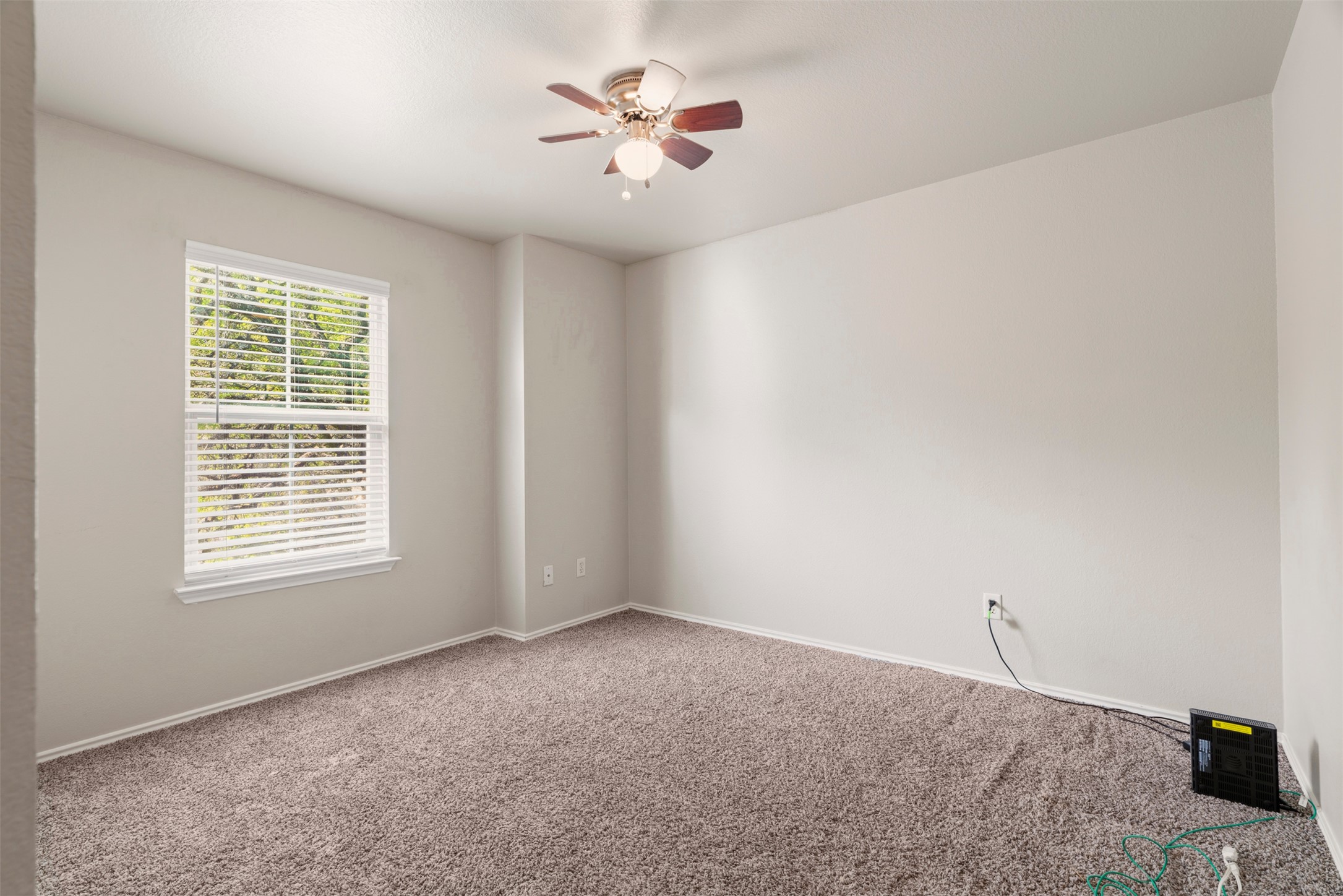 913 Bogart Road Cedar Park, TX 78613 - Photo 21 of 27 Carpeted spare room featuring baseboards and a ceiling fan