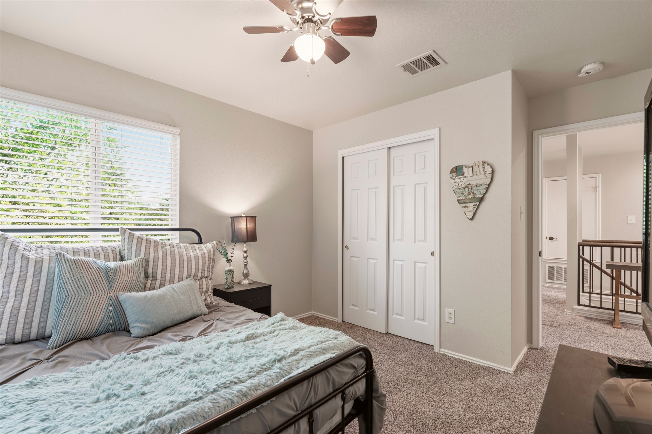 913 Bogart Road Cedar Park, TX 78613 - Photo 22 of 27 Carpeted bedroom featuring a closet and ceiling fan