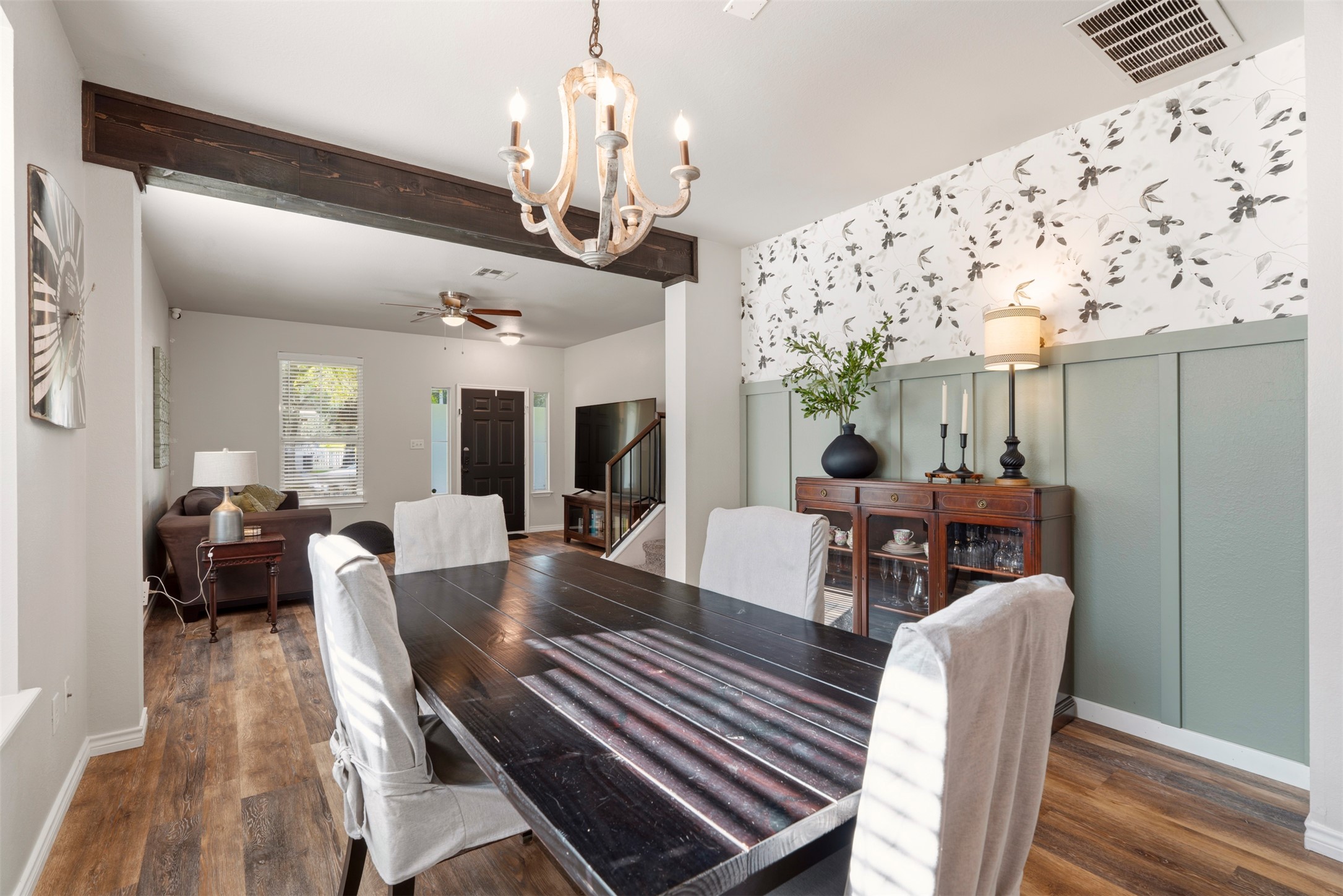 913 Bogart Road Cedar Park, TX 78613 - Photo 4 of 27 Dining room with suspended lighting, dark wood-type flooring, wallpapered walls, and a ceiling fan